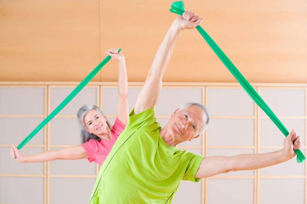 Couple working out with resistance bands