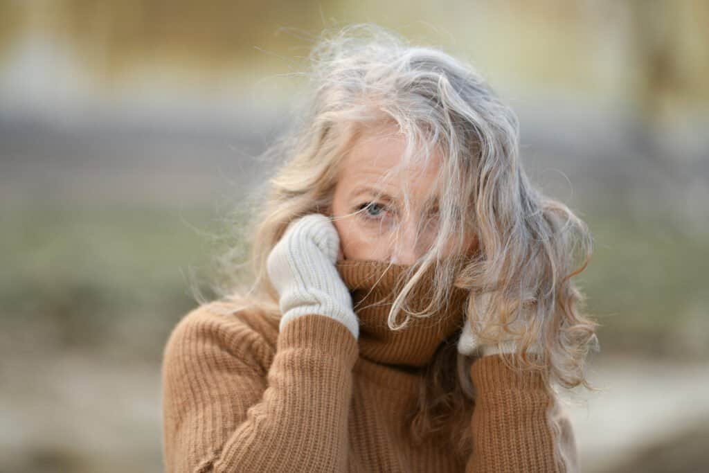 Portrait of a sixty-year-old woman with a grey hair