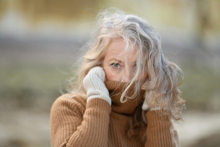 Portrait of a sixty-year-old woman with a grey hair