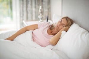 Sinior wiman sleeping in bed